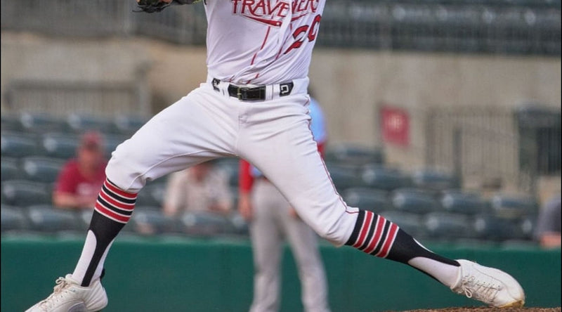 baseball stirrups - professional pitcher wearing TCK stirrup - black stirrups with red and white stripes