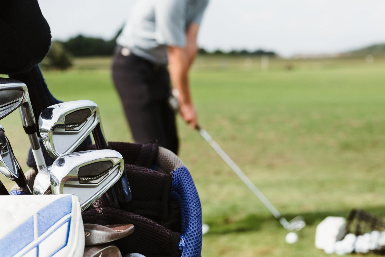 a golfer and a golf bag